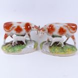 A pair of Staffordshire cows with calves, length 25cm