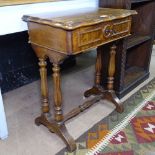 A 19th century French walnut sewing table, with shaped rising top and fitted interior, raised on