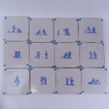 A set of 28 Dutch Delft blue and white ceramic tiles, 13cm x 13cm