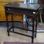 A rectangular oak side table with rising top, Archadian carved frieze on turned legs, W71cm,