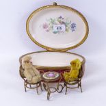 A porcelain box with painted and gilded decoration and metal mount, length 19cm, miniature Schucco