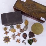 A box with eagle motif, length 19cm, a Maxim's box, and another containing various medallions