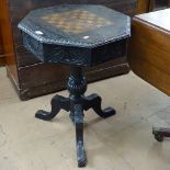 A Victorian oak games-top table, on carved tripod base, W54cm, H71cm