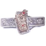 A large American novelty silver and 10ct rose gold-mounted tie clip, in the form of a holstered