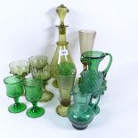 A group of coloured green glass drinking glasses, decanter, vase, jug etc