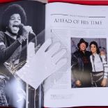 A boxed Michael Jackson "Opus" book, with white glove, height 51cm
