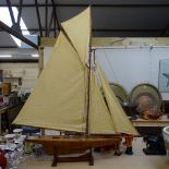 A Vintage pond yacht with sails, length 115cm overall, on stand