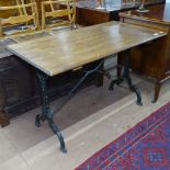 A rectangular oak-top garden table on shaped cast-iron base, W110cm, H70cm, D58cm