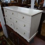 A painted pine chest with 7 various drawers, W136cm, H79cm, D52cm