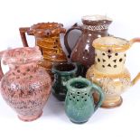 A group of 5 19th century pottery puzzle jugs, including slip glaze and salt glaze, largest height