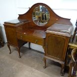 An Edwardian mahogany mirror-back sideboard, with fitted drawer and cupboard pedestals, on