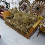 A large Knoll style upholstered and faux crocodile-skin settee, with loose cushions,Purchased from