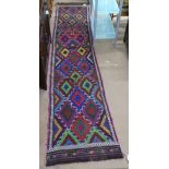 A Suzni Kilim runner, 318cm x 64cm