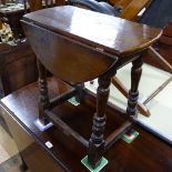 An Antique joined oak drop leaf table, on baluster turned legs, W53cm, H56cm