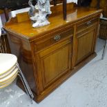 An Edwardian mahogany sideboard, with fitted drawers and cupboards, W150cm, H90cm, D50cm