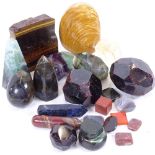 Various gemstone specimens, including watermelon tourmaline, rhombic, dodecahedron garnet,