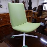 A contemporary design Connection lime green high-back swivel lounge chair, with maker's label