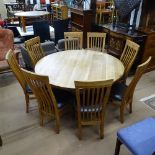 A large solid circular oak dining table, on geometric base, W150cm, H76cm