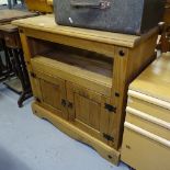 A Mexican pine side cabinet with cupboard doors, W84cm, H79cm, D43cm