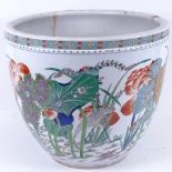 A Chinese jardiniere, with painted and gilded floral and bird decoration, height 32.5cm