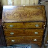 A Georgian elm bureau, with a part satinwood fitted interior, 3 long graduated drawers under,