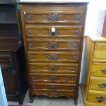 A Continental walnut chest of 7 drawers, with carved fronts on scrolled feet, W74cm, H137cm, D45cm