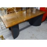 A 1930s Art Deco teak dining table, with the top having scalloped edges on 2 C-shaped pedestals,