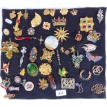 A collection of costume brooches, to include micro-mosaic, a carved ivory brooch, a stylised