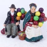 A Royal Doulton The Old Balloon Seller figure, HN1315, and a Doulton The Balloon Man, HN1954,