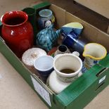 A box with vases, mugs and jugs