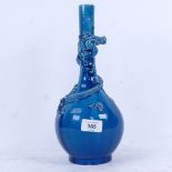 Chinese blue glazed bottle vase with entwined dragon, 31cm