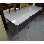 A set of 3 rectangular melamine-topped desks on tubular chrome legs, by Haller L154cm, H75cm, D79cm