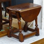 WITHDRAWN: A yew wood drop leaf swivel-top occasional table, on baluster turned legs, W49cm, H46cm