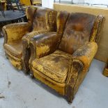 A pair of Vintage brown leather and button-back upholstered wing armchairs