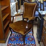 An Edwardian upholstered open armchair