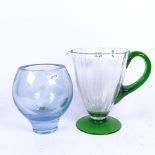 A heavy blue glass globular vase, and a green glass jug, height 21cm (2)