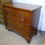 A reproduction crossbanded mahogany chest of 2 short and 3 long drawers, on bracket feet, W76cm,