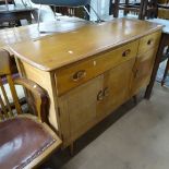 An Ercol mid-century 351 sideboard, fitted with 2 frieze drawers, cupboards under, splayed leg base,