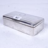 A large George V silver cigarette box of rectangular form, by Stokes & Ireland Ltd, Chester 1921,