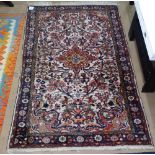 A Persian design wool rug with geometric design, 155cm x 100cm