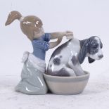 A Lladro porcelain figure of girl washing a dog, model no. 5455, height 12cm