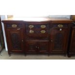 A late Victorian mahogany bow-front sideboard, with fitted drawers, panelled cupboards and relief