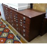 An Antique painted pine-framed bank of 30 drawers, with cup handles, L200cm, H85cm, D60cm