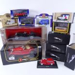 A group of Burago Corgi and Jaguar model toy cars, all boxed