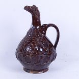 A Turkish Canakkale pottery wine ewer, with figural horse-head spout and thumb cover, height 26cm