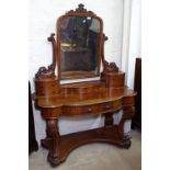 A Victorian mahogany Duchess dressing table, of serpentine form, W125cm, H170cm, D54cm