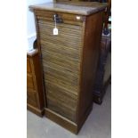 An early 20th century oak filing cabinet, with tambour front, W47cm, H123cm, D41cm