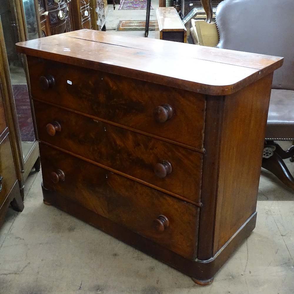 A Victorian round-cornered mahogany chest of 3 long drawers, W100cm, H80cm, D45cm