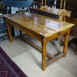 A 19th century fruitwood plank-top refectory dining table, with 2 end frieze drawers, raised on