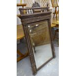 A French carved oak and bevel-framed wall mirror, with fluted columns, W89cm, H138cm